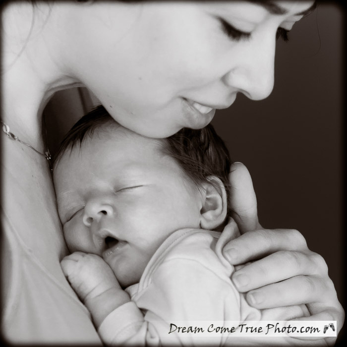 Dream Come True Photo.  Capturing connection: mom just loves her adorable newborn baby boy!