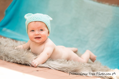Dream Come True Photo: adorable naked cute baby boy is smiling for a camera on his tummy