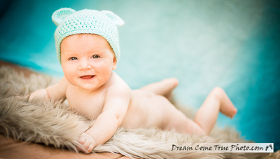 Dream Come True Photo: adorable naked cute baby boy is smiling for a camera on his tummy