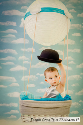 Dream Come True Photo: first birthday cake smash photoshoot - boy with a hat and vest in a hot air balloon