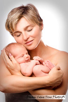 Dream Come True Photo - Authentic Stylish Artistic Portrait of a mom with a newborn baby during family photoshoot