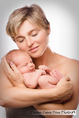 Dream Come True Photo - Authentic Stylish Artistic Portrait of a mom with a newborn baby during family photoshoot